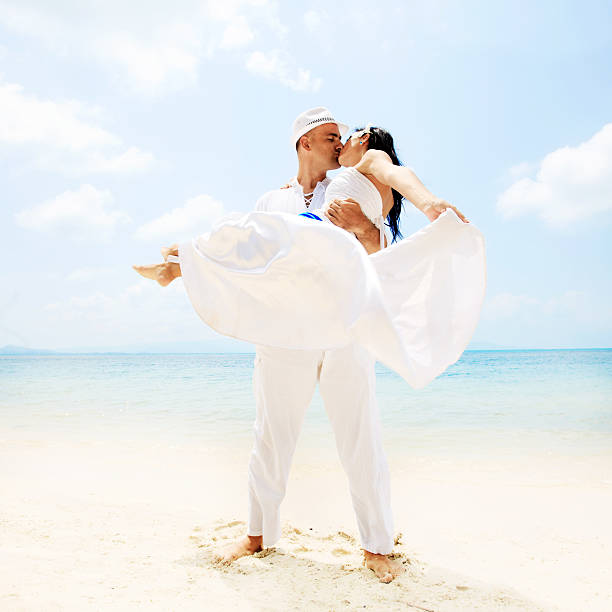 istock Beautiful couple kissing on the beach. 169963144