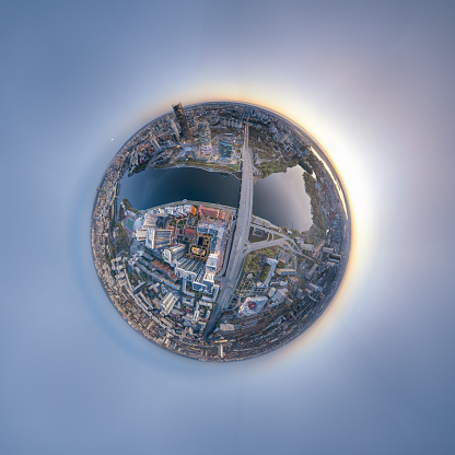 Yekaterinburg city with Buildings of Regional Government and Parliament, Dramatic Theatre, Iset Tower, Yeltsin Center, Aerial summer View. Little planet sphere mode. Evening city in the summer sunset
