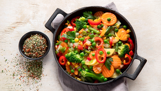 Healthy food cooking.Colorful vegetables on light background. Top view, copy space.