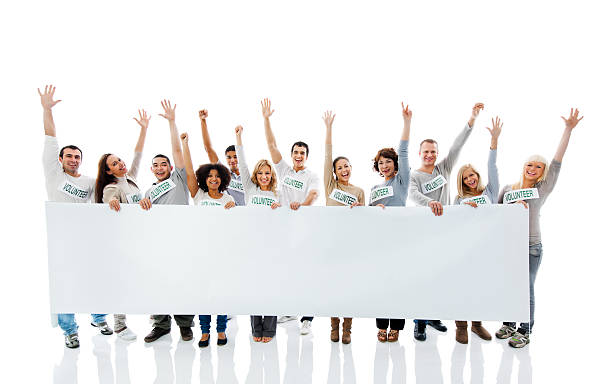 istock Large group of  volunteers holding a big white board. 169968527