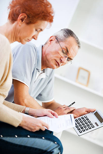 istock Retired couple doing their taxes. 169968545
