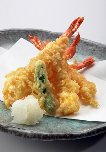 Japanese cuisine tempura shrimps with vegetables on a plate
