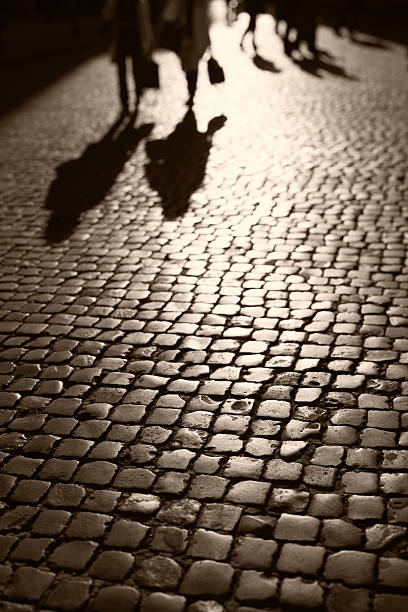 istock People walking on cobblestone in Rome, Italy 169968823