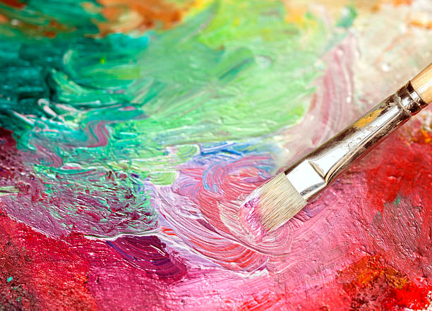 istock Paintbrush with oil paint on a classical palette 169968926