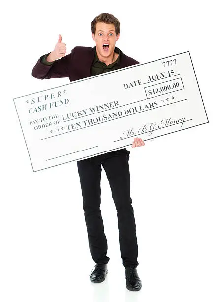 A smiling young man holding a large $10,000 check.