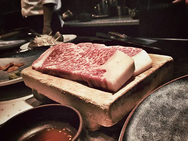 Two fresh cuts of authentic Kobe steak in a restaurant in Kobe, Japan.