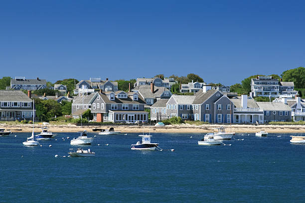 Boats and waterfront Houses, Nantucket, Massachusetts. Clear blue sky. stock photo