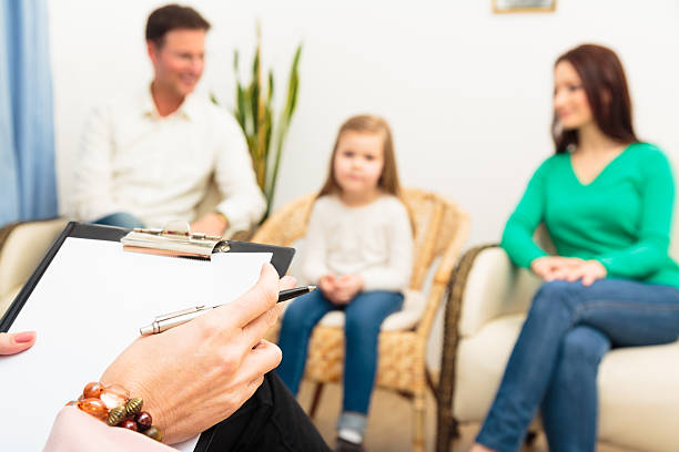 family seeing a psychotherapist stock photo