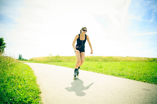 istock young woman with inline skates 169971605