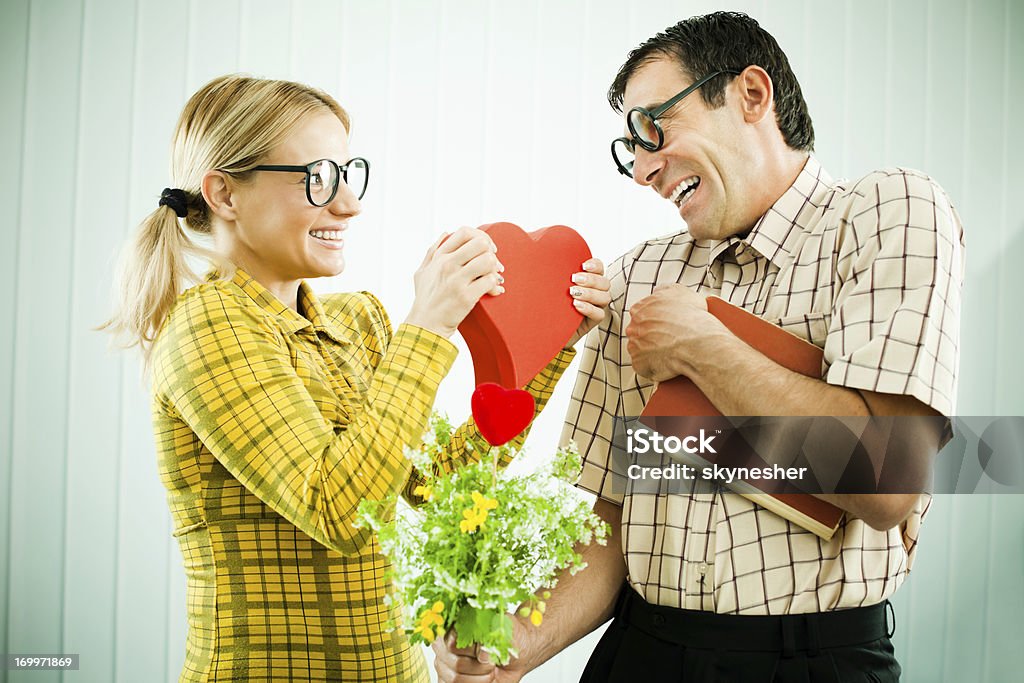 Funny nerds holding Valentine presenta. - Foto de stock de Hombres libre de derechos