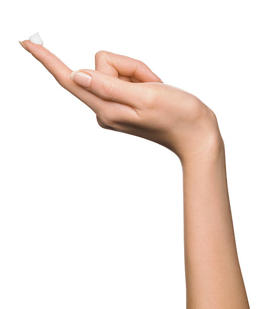 moisturizer on a woman index - closeup finger bildbanksfoton och bilder