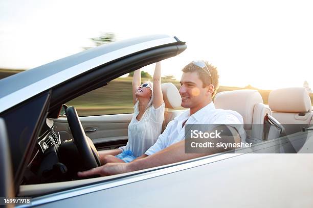 Beautiful Couple Sitting In Their Convertible Car Stock Photo - Download Image Now - Driving, Car, Convertible