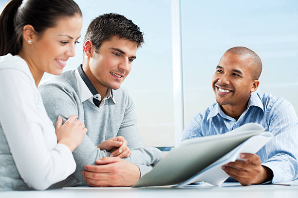istock Couple meeting with financial advisor. 169971938