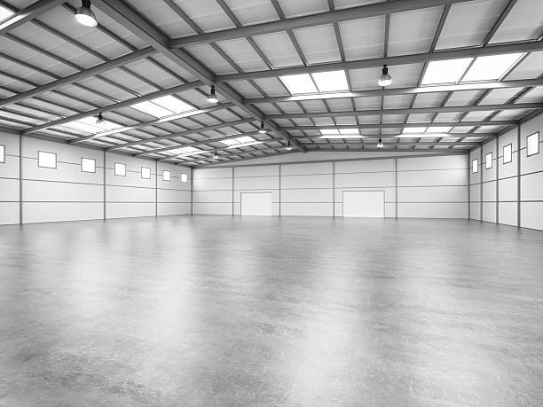 Empty Warehouse Interior of an empty modern warehouse. airplane hangar photos stock pictures, royalty-free photos & images