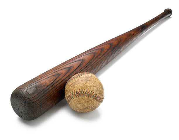 Antique bat and baseball isolated on white background Horizontal photo of an antique baseball bat and baseball isolated on a white background with a clipping path. old baseball stock pictures, royalty-free photos & images