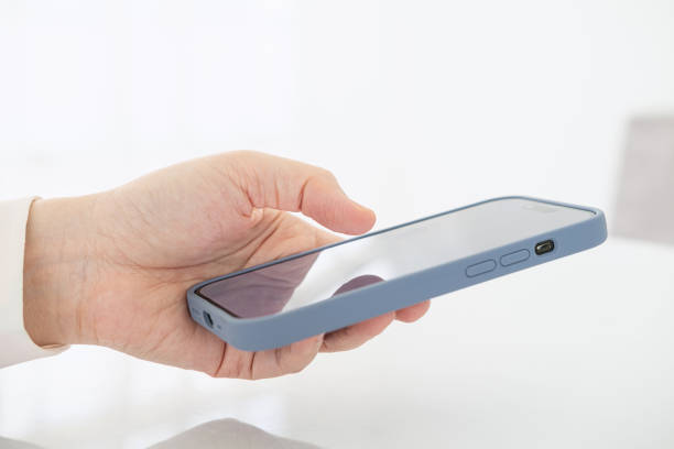 istock Businesswoman sending message with smartphone in modern office. 1699738704