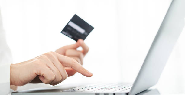 istock Hands holding credit card and using laptop. Online shopping 1699738836