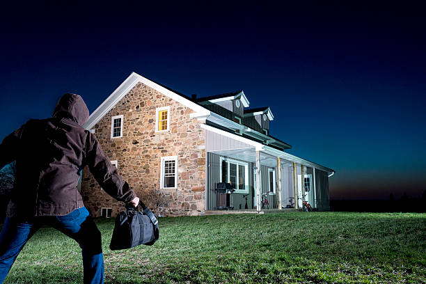 istock Burglar creeping up on a house 169974537