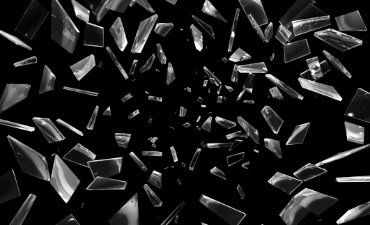 Shattering window glass. Against a black background.