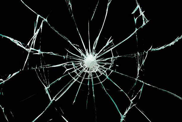クラックトガラス - bullet hole glass cracked hole ストックフォトと画像