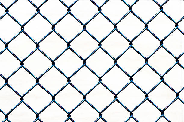 Closeup wire fence aginst white background, copy space Closeup black wire fence against white background, full frame horizontal composition with copy space wire mesh stock pictures, royalty-free photos & images