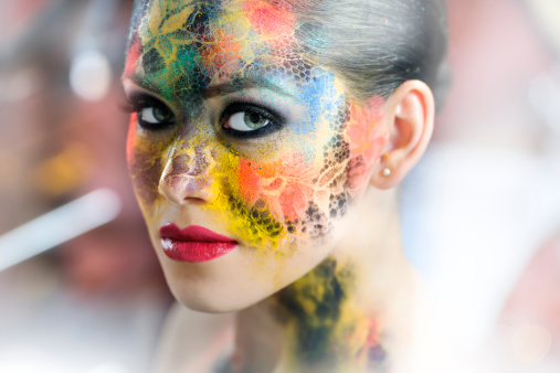 young woman makeup portrait with colorful eyeshadow.