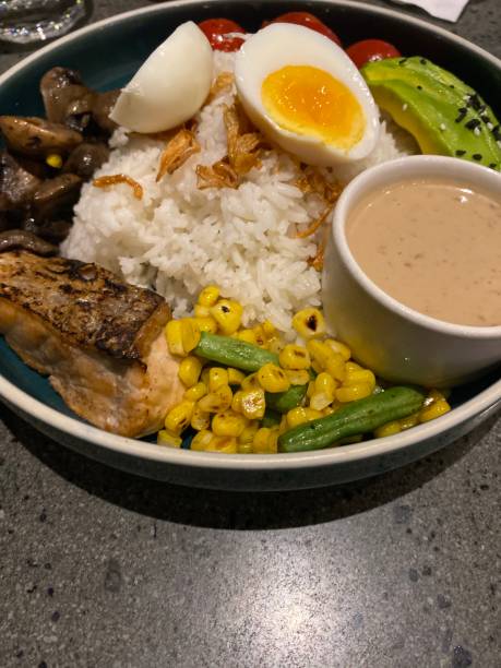 istock rice bowl with avocado corn and salmon 1699765032
