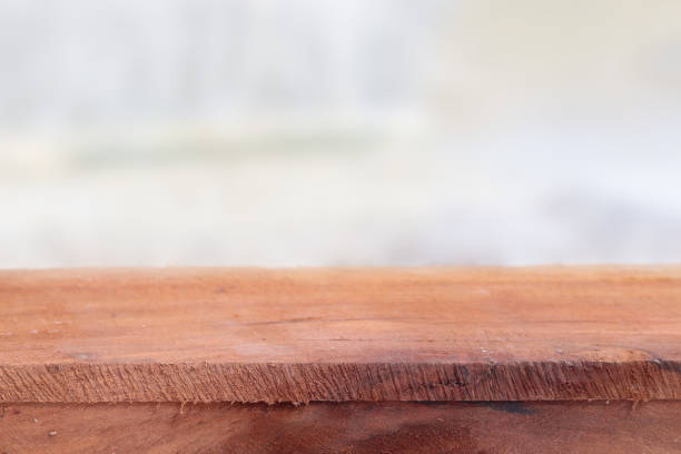 istock Wooden table with blurred white background for product display concept. 1699765551