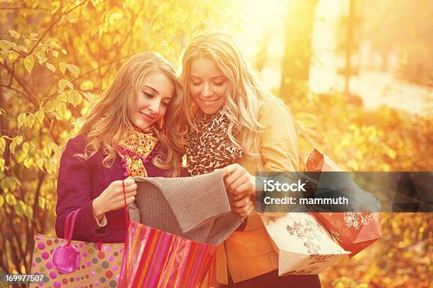 Friends After Shopping In The Autumn Park Stock Photo - Download Image Now - 20-24 Years, 20-29 Years, Active Lifestyle