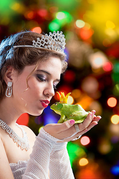 istock Blonde princess kissing a frog prince 169977809