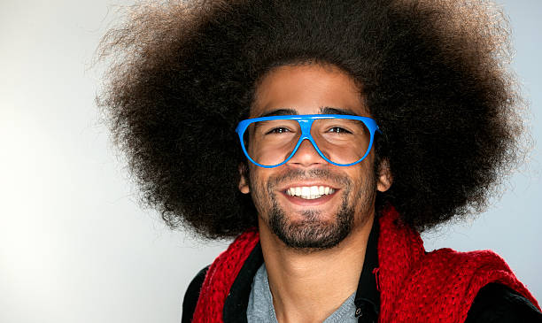 istock smiling cool black man with blue glasses for fun 169977932