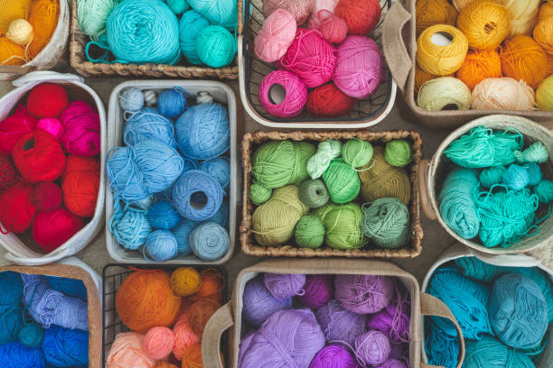istock Many baskets made of natural eco-friendly materials. Multicolor yarn for knitting, knitting needles 1699797421