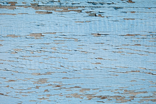 Old weathered blue wooden board background.