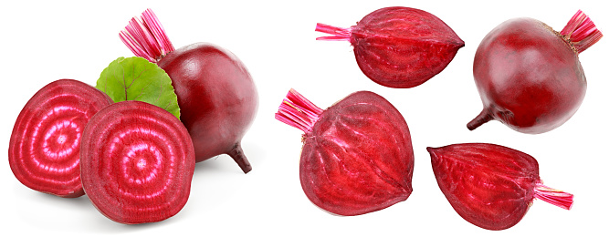 beetroot with pieces of beetroot and green leaf isolated on white background. clipping path