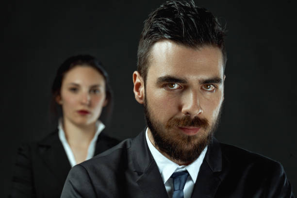 istock Potentially powerful woman accompanies the bearded man 1699823615