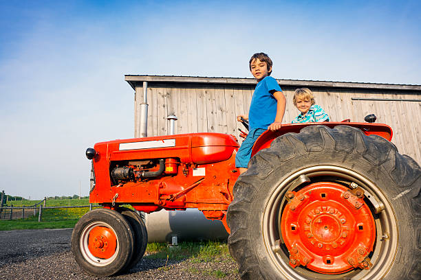 istock Farm kids on a tractor. 169982471