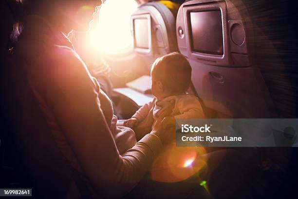 Airplane Travel With Infant Stock Photo - Download Image Now - Baby - Human Age, Airplane, Flying