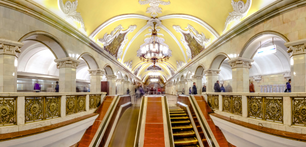 Panoramic view of escalator at the Komsomolskaya metro station of the Koltsevaya Line (Circle Line), Moscow, Russia. The station is noted for its being located under the busiest Moscow transport hub, Komsomolskaya Square, which serves Leningradsky, Yaroslavsky and Kazansky railway terminals. Because of that the station is one of the busiest in the whole system and is the most loaded one on the line.