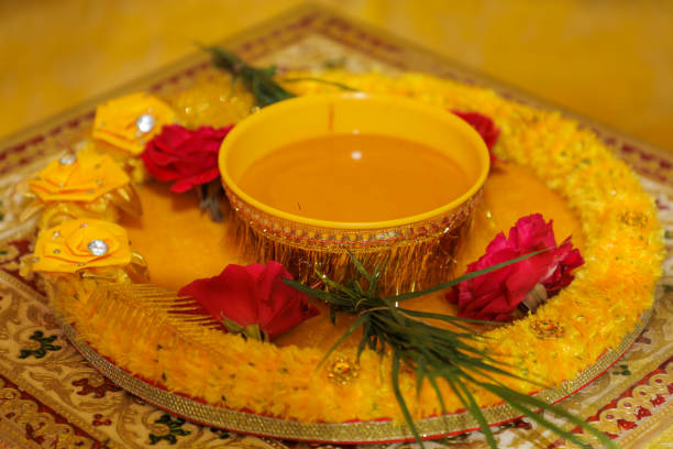 istock Groom and bridal marriage ritual haldi function decorative plat 1699839244