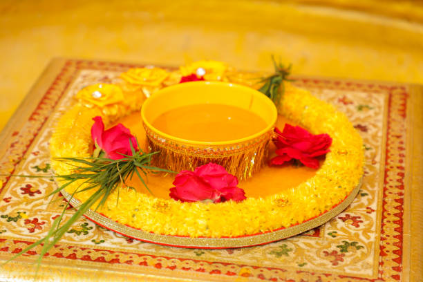 istock Groom and bridal marriage ritual haldi function decorative plat 1699839672