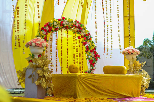istock Stage decorated with very beautiful flowers for Indian wedding haldi function 1699839716