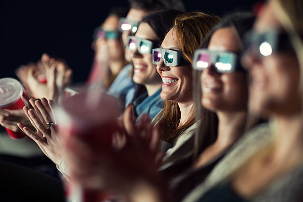 Audience Watching Movie with 3-d glasses. stock photo