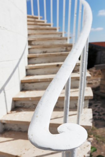 Paphos white lighthouse stair steps  Cyprus against blue sky
