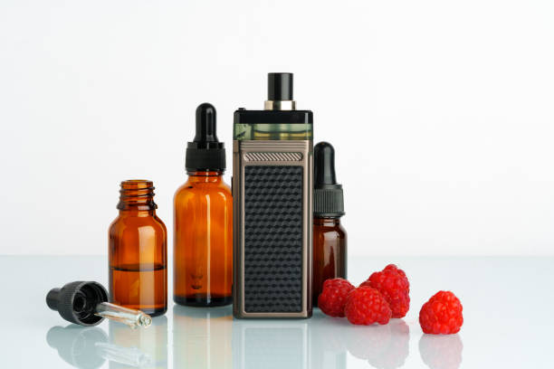 istock Vape smoking liquid with berry flavor close up 1699864755