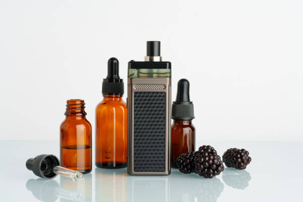 istock Vape smoking liquid with berry flavor close up 1699869603