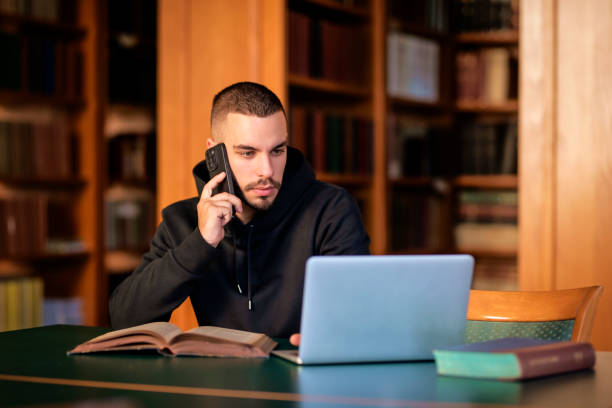 istock University student sitting in the library and using laptop for learning 1699873454