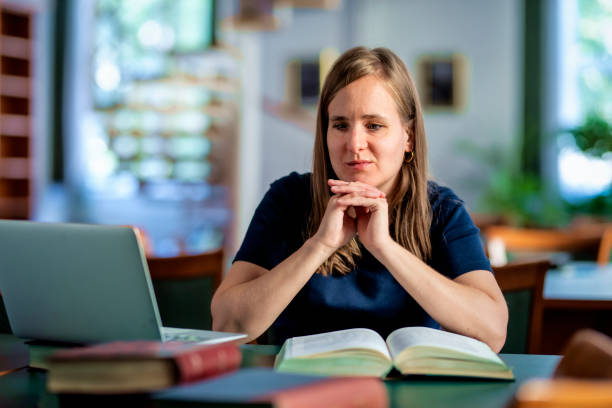 istock A visually impaired young woman sitting and studying in the university library 1699877798