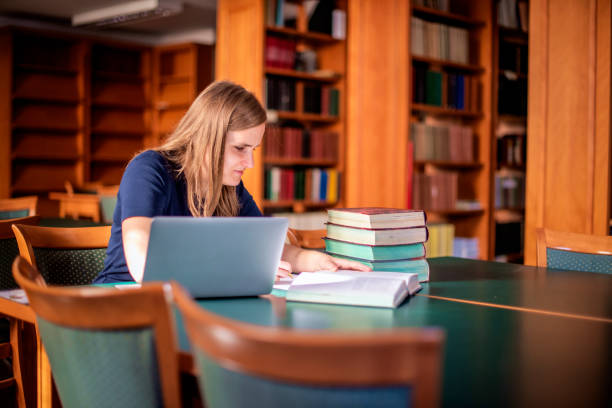 istock A visually impaired young woman sitting and studying in the university library 1699878033