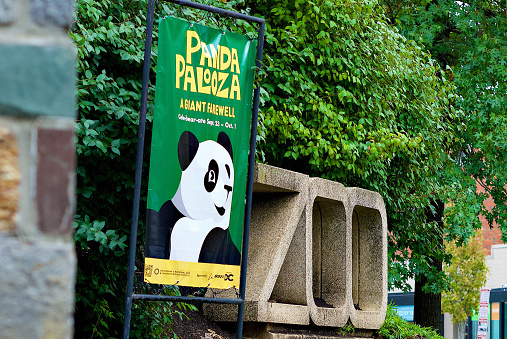 Washington, D.C., USA - September 24, 2023: A banner advertising “Panda Palooza: A Giant Farewell” greets visitors at the entrance to the Smithsonian’s National Zoo as the Zoo’s pandas prepare to return to China to honor the terms of its agreement with the China Wildlife Conservation Association.