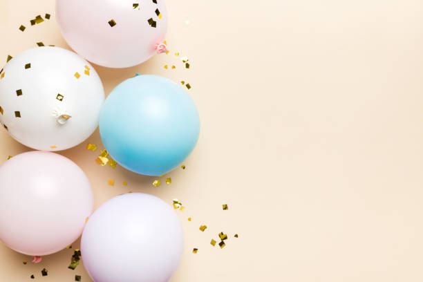 istock Background with fastive air balloons of round shape and confetti, multicoloured top view. Birthday party background 1699896985